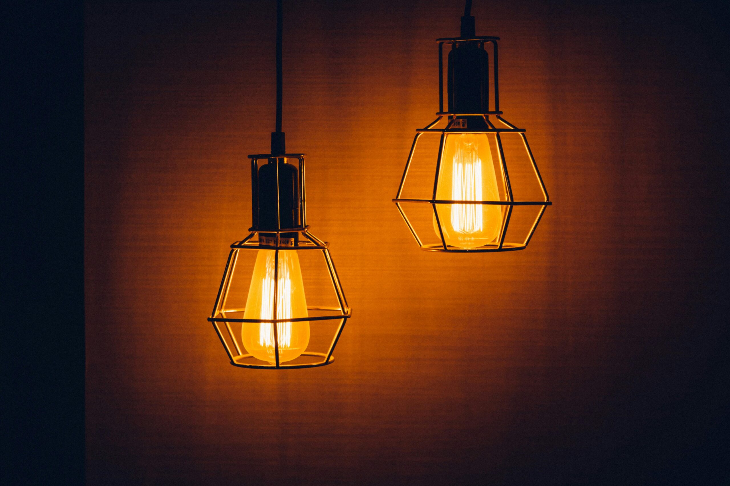 Close-up of glowing vintage pendant light bulbs creating a warm, inviting ambiance.