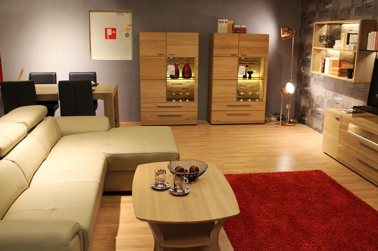 A stylish living room with a comfortable couch, coffee table, TV, and a wine rack, creating a welcoming atmosphere.